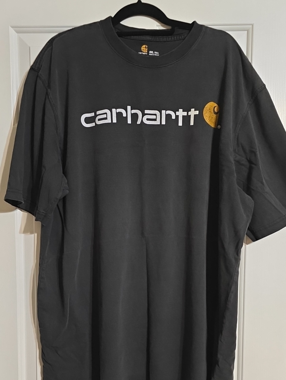 Carhartt Black Short-Sleeve Tee with White Logo and Gold Emblem